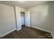 Bright bedroom with wood-look floors and spacious closet at 3225 Cricketeer Dr, Charlotte, NC 28216