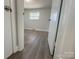 View of bedroom with wood-look floors and a window at 3225 Cricketeer Dr, Charlotte, NC 28216