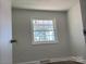 Well-lit bedroom featuring a large window and wood-look floors at 3225 Cricketeer Dr, Charlotte, NC 28216