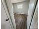 Simple bedroom with hardwood floors and a window at 3225 Cricketeer Dr, Charlotte, NC 28216