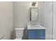 Updated bathroom, blue vanity, white subway tile shower at 3728 Severn Ave, Charlotte, NC 28210