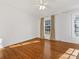 Hardwood floor bedroom with ceiling fan and large windows at 3728 Severn Ave, Charlotte, NC 28210