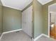 Clean hallway with tile floors and neutral-colored walls at 3728 Severn Ave, Charlotte, NC 28210