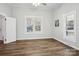 Bright bedroom with hardwood floors and neutral walls at 402 N Davis Ave, Newton, NC 28658