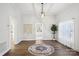 Dining room features hardwood floors, a modern chandelier and a circular rug at 402 N Davis Ave, Newton, NC 28658