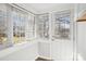 Sunroom with white door and windows offering backyard views at 402 N Davis Ave, Newton, NC 28658