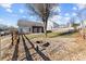 Backyard with fire pit, gravel, and wooden fence at 5809 Avian Sw Pl, Concord, NC 28025