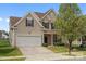 Inviting two-story home with a two-car garage, well-kept lawn, and traditional design elements in a desirable neighborhood at 6107 Follow The Trl, Indian Trail, NC 28079