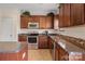 Kitchen with island and stainless steel appliances at 6107 Follow The Trl, Indian Trail, NC 28079