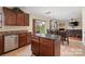 Kitchen with island, stainless steel appliances, and view to Gathering room at 6107 Follow The Trl, Indian Trail, NC 28079