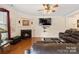 Living room with fireplace and leather furniture at 6107 Follow The Trl, Indian Trail, NC 28079