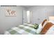 Bright bedroom with a double bed, a world map, and access to a hallway at 717 Wagon Cross Ct, York, SC 29745