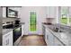 Modern kitchen with stainless steel appliances and granite countertops at 717 Wagon Cross Ct, York, SC 29745