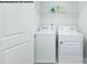 Laundry room with washer, dryer, and overhead shelving at 717 Wagon Cross Ct, York, SC 29745