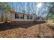 Beige mobile home with brick skirt, green shutters, and wood steps at 746 Dallas Spencer Mtn Rd, Dallas, NC 28034