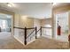 Upstairs hallway with carpet and access to bedrooms at 7701 Palmerfield Dr, Mint Hill, NC 28227