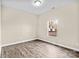 Spacious bedroom with large window and wood-look floors at 801 S Long St, Salisbury, NC 28144