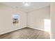 Bright bedroom with wood-look flooring and a large window at 801 S Long St, Salisbury, NC 28144