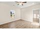 Bedroom with window, wood-look floors and ceiling fan at 801 S Long St, Salisbury, NC 28144