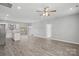 Open floor plan living area with kitchen and wood-look floors at 801 S Long St, Salisbury, NC 28144