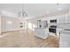 Open concept living room and kitchen with hardwood floors at 801 S Long St, Salisbury, NC 28144