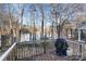 Deck overlooking a serene lake with wooded backdrop at 1009 Stinson Glen Ln, Charlotte, NC 28214