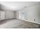 Simple bedroom with carpet flooring and neutral color palette at 11015 Vista Haven Dr, Charlotte, NC 28226