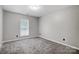 Simple bedroom with gray carpet and window at 11015 Vista Haven Dr, Charlotte, NC 28226