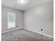 Spacious bedroom with gray carpet and window at 11015 Vista Haven Dr, Charlotte, NC 28226