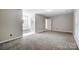 Bedroom with grey carpet, en-suite bathroom access, and neutral walls at 11015 Vista Haven Dr, Charlotte, NC 28226