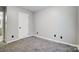 Simple bedroom with gray carpeting and a closet at 11015 Vista Haven Dr, Charlotte, NC 28226