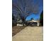 Ranch house with driveway and mature tree in front at 11015 Vista Haven Dr, Charlotte, NC 28226