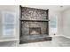 Large stone fireplace with wood mantel at 11015 Vista Haven Dr, Charlotte, NC 28226