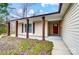 House exterior featuring a red front door and covered porch at 11015 Vista Haven Dr, Charlotte, NC 28226