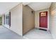 Red front door entry with a sidelight and dark brown shutters at 11015 Vista Haven Dr, Charlotte, NC 28226