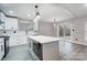 Updated kitchen featuring an island and sliding glass doors to backyard at 11015 Vista Haven Dr, Charlotte, NC 28226