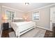 Bright bedroom with a queen-size bed and neutral color palette at 1108 Sewickley Dr, Charlotte, NC 28209