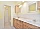 Bathroom with double sinks, a shower, and access to a separate toilet at 11201 Idlewild Rd, Matthews, NC 28105