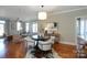 Open dining area with hardwood floors and a round table at 1129 Park West Dr, Charlotte, NC 28209