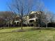 Brick building with multiple units, balconies, and manicured lawn at 1129 Park West Dr, Charlotte, NC 28209