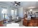 Bright living room features hardwood floors, neutral walls, and access to a balcony at 1129 Park West Dr, Charlotte, NC 28209