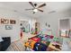 bedroom with playful decor, built-in shelving and a colorful bedspread at 126 Liberty St, Mooresville, NC 28115