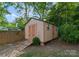 Tan storage shed with double doors and ramp at 126 Liberty St, Mooresville, NC 28115