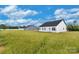 View of new homes showing siding and roof lines at 143 Tranquility Ln, Harmony, NC 28634