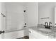 Modern bathroom featuring a shower-tub combo and granite countertop vanity at 143 Tranquility Ln, Harmony, NC 28634
