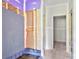 An unfinished bathroom displays a shower under construction next to a hallway leading to other rooms at 143 Tranquility Ln, Harmony, NC 28634