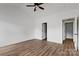 Spacious bedroom featuring hardwood floors, fresh paint, walk-in closet, and natural light at 143 Tranquility Ln, Harmony, NC 28634