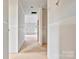 Unfinished hallway with view to other rooms and roughed-in electrical at 143 Tranquility Ln, Harmony, NC 28634