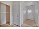 Unfinished hallway featuring two white doors and an open doorway at 143 Tranquility Ln, Harmony, NC 28634