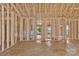 Unfinished interior framing of a new home with an open floor plan, ready for customization and finishing touches at 143 Tranquility Ln, Harmony, NC 28634